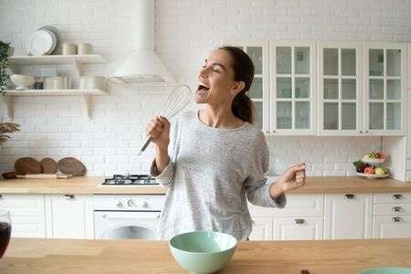 woman singing in kitchen place